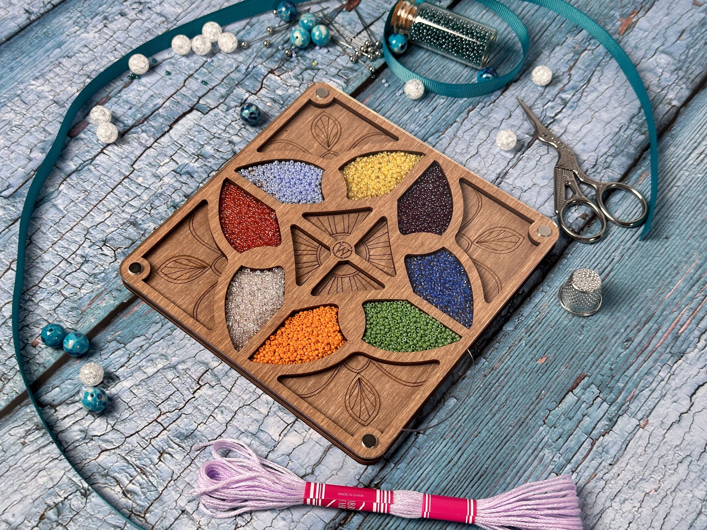 a wooden box with a flower design on it
